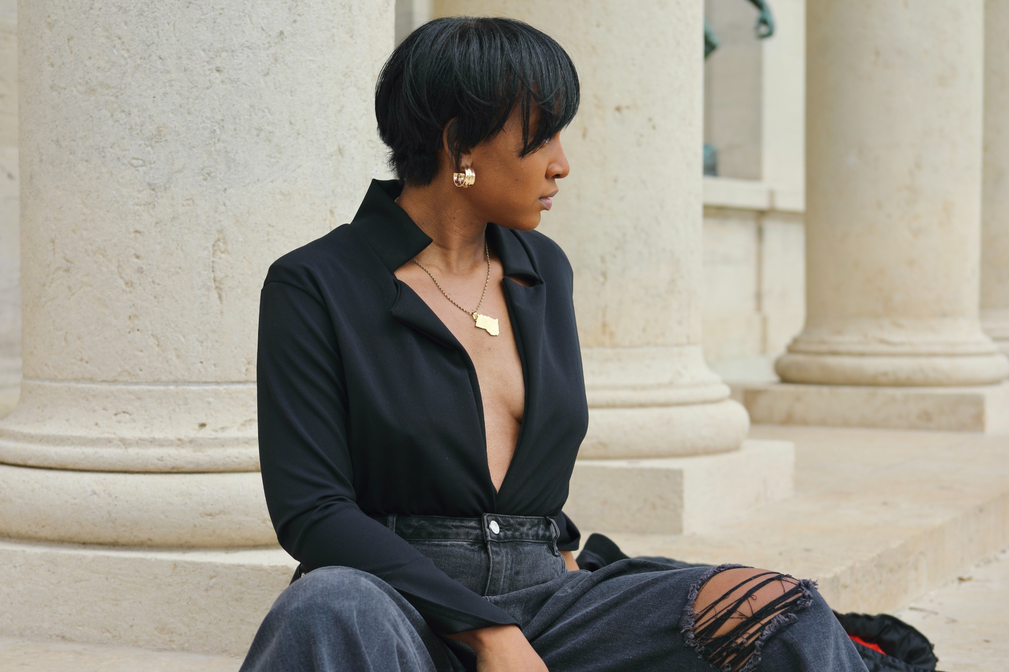 Tiffani Kennard seated upright, turned away