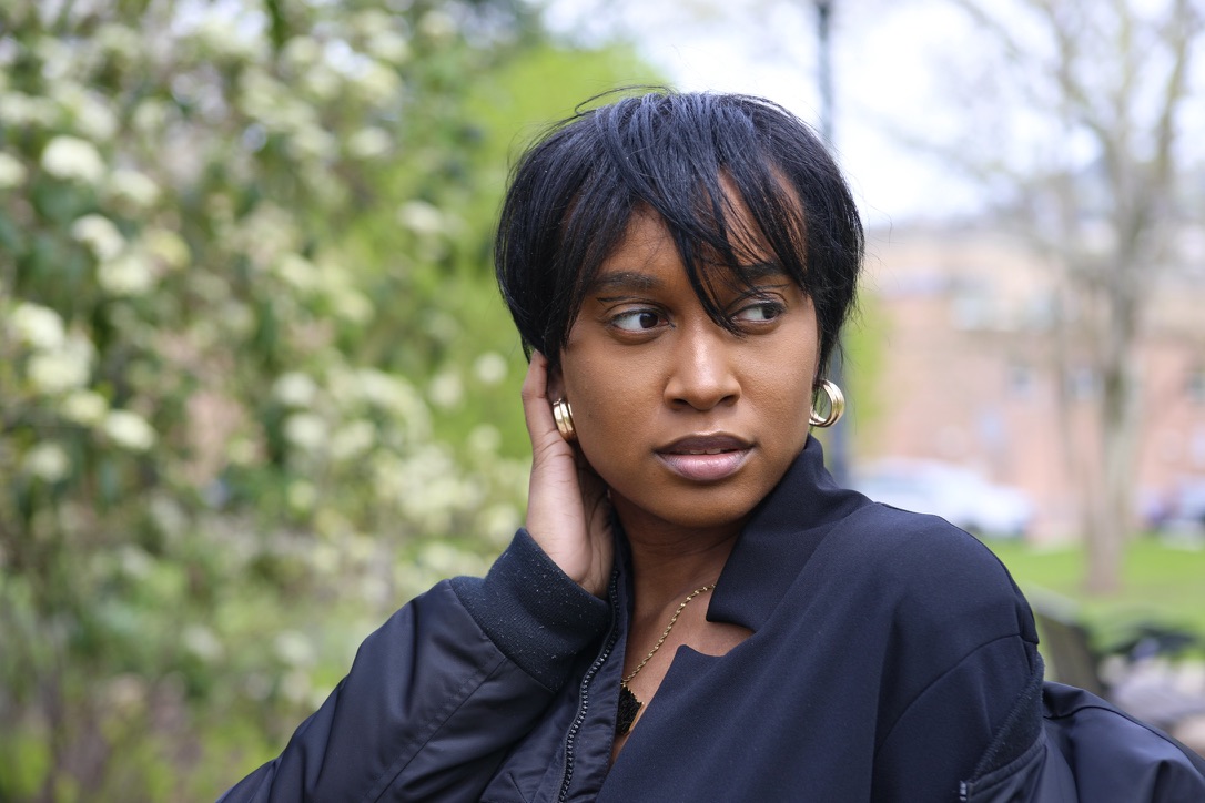 Close portrait of Tiffani Kennard in black tailoring
